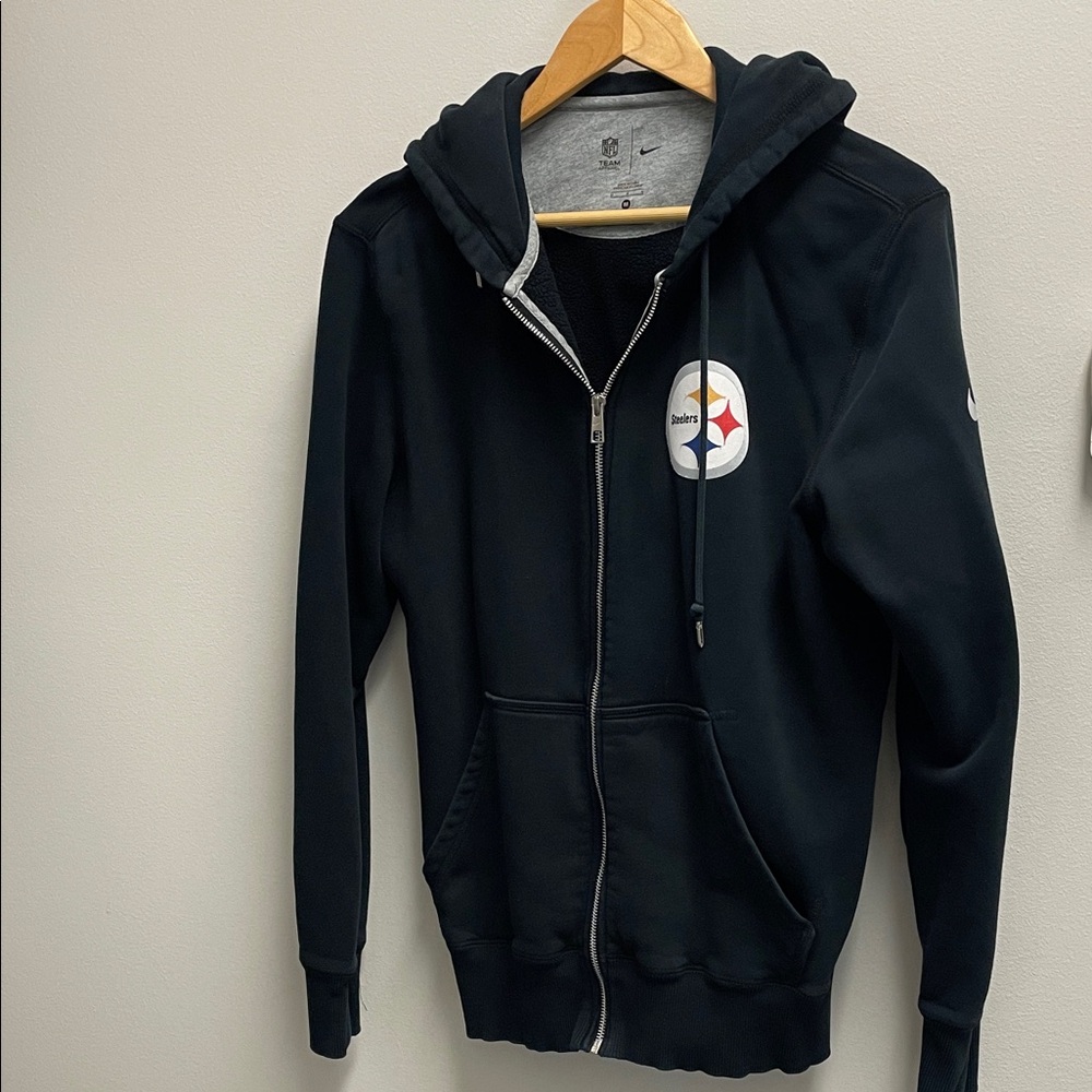 Nike team apparel.  Men's Black Hoodie with Steelers logo.